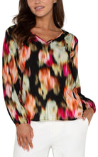 Load image into Gallery viewer, Experience the luxury of our Lilibet Long Sleeve V-neck Shirred Woven Blouse, boasting a stunning ruby floral print. Made with a lightweight woven fabric, this blouse provides effortless drape and exceptional comfort. Its long sleeves make it ideal for day-to-night wear, and the relaxed fit allows for unrestricted movement and all-day wearability.
