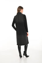 Load image into Gallery viewer, Woman wearing a black vest with abstract design, black long sleeve top, black leggings and black boots against a white background.