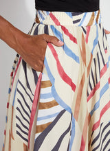 Load image into Gallery viewer, Expertly designed with a handkerchief point detail and wide bottom facing, the Lorenza Midi Handkerchief Skirt exudes chicness and fluidity. Crafted from Lightweight Satin and partially lined with Georgette, it pairs gracefully with the Evie Scoop Neck Tank and sandals.