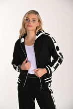 Load image into Gallery viewer, Woman wearing a black and white patterned jacket and matching pant on a white background.