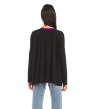 Load image into Gallery viewer, A modern look is achieved through the color blocked panels in this jersey-knit top. It's ideal for casual days, combining warmth and fashion. This top pairs well with any denim. Color- Magenta and black. Colorblock design. Long sleeve. Hi-low hem. Side-slits. Heavy Rayon Spandex: 90% Rayon. 10% Spandex. Care - Machine wash separately cold water or dry clean.