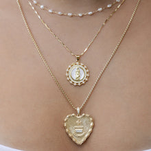 Load image into Gallery viewer, Model wearing three gold necklaces.