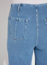 Load image into Gallery viewer, The Lyssé Margo Hi Waist Wide Crop Denim is a stylish and flattering wide-leg jean designed for comfort and elegance. Featuring a flowy palazzo shape, this denim pant offers an elongating look with a concealed patented waistband, belt loops, wide band inserts near the hem, side darts, and 70s-inspired patch pockets. The raw-edge hem allows for easy customization, making it simple to shorten if needed.