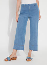Load image into Gallery viewer, The Lyssé Margo Hi Waist Wide Crop Denim is a stylish and flattering wide-leg jean designed for comfort and elegance. Featuring a flowy palazzo shape, this denim pant offers an elongating look with a concealed patented waistband, belt loops, wide band inserts near the hem, side darts, and 70s-inspired patch pockets. The raw-edge hem allows for easy customization, making it simple to shorten if needed.