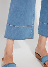 Load image into Gallery viewer, The Lyssé Margo Hi Waist Wide Crop Denim is a stylish and flattering wide-leg jean designed for comfort and elegance. Featuring a flowy palazzo shape, this denim pant offers an elongating look with a concealed patented waistband, belt loops, wide band inserts near the hem, side darts, and 70s-inspired patch pockets. The raw-edge hem allows for easy customization, making it simple to shorten if needed.