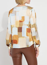 Load image into Gallery viewer, Crafted from two-way stretch Hammered Silk-Touch Satin, the Marie Blouse features an open neckline, asymmetrical front pleats, a high-low hemline, and double-box pleats on the sleeves for added volume. It fits true to size and pairs well with Ankle Elysse Vegan Leather pants in chalk and ankle boots. To remove any wrinkles after delivery, a gentle steaming or ironing is recommended.