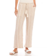 Load image into Gallery viewer, Discover a perfect blend of laid-back comfort and chic style with the Marlowe Metallic Stripe Drawstring Ankle Pants by Karen Kane. Crafted with lightweight gauze fabric, enhanced by delicate gold metallic accents, these pants are designed to elevate your everyday look. The drawstring waist ensures a customizable fit, while the ankle-length design adds a modern touch. Versatile and stylish, they're ideal for any springtime occasion.