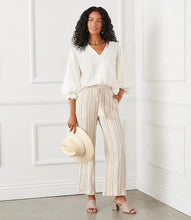 Load image into Gallery viewer, Discover a perfect blend of laid-back comfort and chic style with the Marlowe Metallic Stripe Drawstring Ankle Pants by Karen Kane. Crafted with lightweight gauze fabric, enhanced by delicate gold metallic accents, these pants are designed to elevate your everyday look. The drawstring waist ensures a customizable fit, while the ankle-length design adds a modern touch. Versatile and stylish, they're ideal for any springtime occasion.