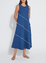 Load image into Gallery viewer, Make a statement with the Mirabella Fringed Midi Denim Dress by Lysse. Designed for comfort and style, this dress features a midi-length silhouette with fringed detailing, adding a touch of effortless charm. Crafted from premium stretch denim, it offers a flattering fit while ensuring all-day ease.