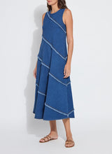 Load image into Gallery viewer, Make a statement with the Mirabella Fringed Midi Denim Dress by Lysse. Designed for comfort and style, this dress features a midi-length silhouette with fringed detailing, adding a touch of effortless charm. Crafted from premium stretch denim, it offers a flattering fit while ensuring all-day ease.
