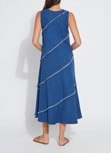 Load image into Gallery viewer, Make a statement with the Mirabella Fringed Midi Denim Dress by Lysse. Designed for comfort and style, this dress features a midi-length silhouette with fringed detailing, adding a touch of effortless charm. Crafted from premium stretch denim, it offers a flattering fit while ensuring all-day ease.