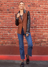 Load image into Gallery viewer, Combine the look of a cool-weather jacket with a blazer for an exceptional style. This bold statement piece includes contrasting faux leather sleeves with fabric cuffs and collar, two front flap pockets, and a traditional button closure, ideal for infusing a contemporary twist into your wardrobe.
