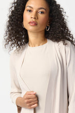 Load image into Gallery viewer, This stylish cover-up/cardigan features extended side openings and flared sleeves that impart a sense of fluidity and grace while in motion. The decorative studs along the openings add a touch of bold sophistication, making it perfect for both professional and casual settings. Color- Moonstone. Drape silhouette. No pockets. No zipper. Not lined. Side splits lined with silver hardware.