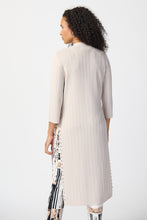 Load image into Gallery viewer, This stylish cover-up/cardigan features extended side openings and flared sleeves that impart a sense of fluidity and grace while in motion. The decorative studs along the openings add a touch of bold sophistication, making it perfect for both professional and casual settings. Color- Moonstone. Drape silhouette. No pockets. No zipper. Not lined. Side splits lined with silver hardware.