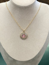 Load image into Gallery viewer, Necklace with a pink gemstone pendant on a mannequin bust.