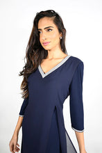 Load image into Gallery viewer, This beautiful V-neck dress comes in a luxurious navy shade with sparkling rhinestone trim along the front neckline and sleeves. The elegant chiffon split in the front offers a flowing look ideal for any special occasion. An absolute timeless classic. Color -Midnight blue with clear crystals. V-Neck. Chiffon overlay. Split fabrication in front. Crystal detailing at neckline and cuffs. Long sleeve. Knit/Woven Dress Fabric -95% Polyester. 5% Elasthane.