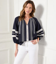 Load image into Gallery viewer, Lightweight cotton gives a breezy quality to this peasant top detailed with charming embroidery. This breezy top pairs perfectly with white pants for a fresh beachy look. Comes in both regular and plus sizes. Colors- Navy and white. Blouson sleeve V-neck Embroidered.