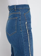 Load image into Gallery viewer, The Noah Hi Waist Crop Wide Fringe Denim is carefully crafted with two-color tobacco topstitching, a fringed hem, beltloops, back pockets, and a self-fringe insert on the side seams to provide an authentic denim look. Made from "Holding Power" Denim, this woven denim adapts to all shapes for maximum comfort and flattering fit. With a concealed patented waistband, two-way stretch, and pull-on styling, these must-have jeans are fitted through the waist and hip with a wide, cropped leg.