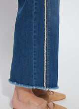 Load image into Gallery viewer, The Noah Hi Waist Crop Wide Fringe Denim is carefully crafted with two-color tobacco topstitching, a fringed hem, beltloops, back pockets, and a self-fringe insert on the side seams to provide an authentic denim look. Made from "Holding Power" Denim, this woven denim adapts to all shapes for maximum comfort and flattering fit. With a concealed patented waistband, two-way stretch, and pull-on styling, these must-have jeans are fitted through the waist and hip with a wide, cropped leg.