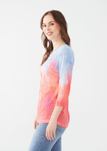 Load image into Gallery viewer, Unleash effortless style with the FDJ French Dressing Notch Neck 3/4 Sleeve Jersey Top. This chic and comfortable top features a mesmerizing abstract print in a vibrant Flamingo Gradient, making it the perfect addition to your collection. Styles beautifully with dress pants, jeans, shorts and skirts.