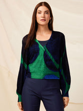 Load image into Gallery viewer, Woman wearing a blue and green patterned cardigan sweater with long bishop sleeves.