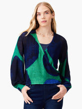 Load image into Gallery viewer, Woman wearing a blue and green patterned cardigan sweater with long bishop sleeves.