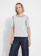 Load image into Gallery viewer, Crafted with Lightweight Double Face Cashmere, the Odessa Reversible Knit Short Sleeve Tee boasts a straight, boxy fit and features side slits, a crew neck, and a center back seam. This top is true to size and can be worn two ways for versatility, making it an ideal transitional piece that pairs well with pants, skirts, and shorts.