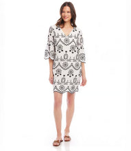 Load image into Gallery viewer, Experience the enchanting charm of this embroidered dress and unleash your inner bohemian spirit. Capturing the essence of effortless sophistication, this dress includes a gentle lining to preserve the integrity of the design and intricate eyelet accents that exude a feeling of uninhibited self-assurance.