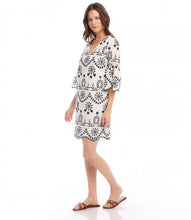 Load image into Gallery viewer, Experience the enchanting charm of this embroidered dress and unleash your inner bohemian spirit. Capturing the essence of effortless sophistication, this dress includes a gentle lining to preserve the integrity of the design and intricate eyelet accents that exude a feeling of uninhibited self-assurance.