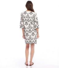 Load image into Gallery viewer, Experience the enchanting charm of this embroidered dress and unleash your inner bohemian spirit. Capturing the essence of effortless sophistication, this dress includes a gentle lining to preserve the integrity of the design and intricate eyelet accents that exude a feeling of uninhibited self-assurance.