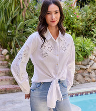 Load image into Gallery viewer, This lovely top is constructed with cotton fabric, allowing for softness and breathability. It showcases a floral embroidery in an eyelet design, elevating any ensemble with a touch of sophistication and femininity.