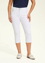 Load image into Gallery viewer, These capris in a crisp white color, feature tiny, sparkling rhinestone embellishment on the front of each leg, adding a touch of sparkle and elegance to their design. With a mid-rise waist, slim leg shape, and a cropped length of 21 inches, they offer a flattering and polished look.