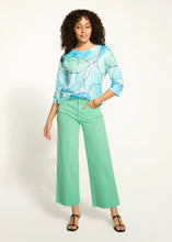 Load image into Gallery viewer, Make a statement in these effortlessly stylish wide-leg ankle jeans. Featuring a pintuck front seam and a frayed hemline, the Olivia design blends sophistication with a touch of modern edge. The high-rise waist provides a flattering fit, while the comfortable fabric ensures ease of movement all day long. Perfect for pairing with your favorite heels or sneakers, this versatile piece is a must-have addition to any wardrobe.