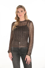 Load image into Gallery viewer, Woman wearing a brown open knit sweater and black jeans against a white background.