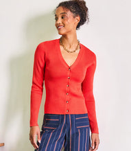 Load image into Gallery viewer, Add a pop of color to your spring wardrobe with this vibrant orange ribbed cardigan. Featuring a classic button-front design and long sleeves, this versatile piece is perfect for layering over any outfit or wearing on its own. Its ribbed texture adds a touch of elegance while ensuring a comfortable fit. Whether you're dressing up for a day at the office or keeping it casual on the weekends, this cardigan is the perfect addition to your spring collection.