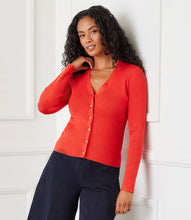 Load image into Gallery viewer, Add a pop of color to your spring wardrobe with this vibrant orange ribbed cardigan. Featuring a classic button-front design and long sleeves, this versatile piece is perfect for layering over any outfit or wearing on its own. Its ribbed texture adds a touch of elegance while ensuring a comfortable fit. Whether you're dressing up for a day at the office or keeping it casual on the weekends, this cardigan is the perfect addition to your spring collection.