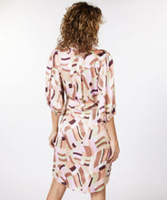 Load image into Gallery viewer, A captivating composition of color and pattern culminate in a simply stunning dress. Our Gena features a timeless silhouette paired with a geometric print to create a flattering, dynamic look. Completed with three quarter, billowy, elasticized sleeves and a side tie. Colors- Brown, pink, lilac, mint green. Collared. Wrap style dress. Billowy three quarter, elasticized sleeves. Side tie. Geometric print.