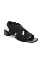 Load image into Gallery viewer, These stylish black slip-on sandals combine fashion and comfort, thanks to a flexible knit fabric and sleek organic heel. Elevate your look while staying comfortable all day long.