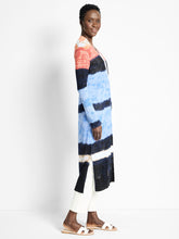 Load image into Gallery viewer, Woman wearing a colorful striped cardigan against a white background.