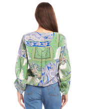 Load image into Gallery viewer, Featuring a captivating green and blue paisley print, this top effortlessly commands attention with its vibrant hues and eye-catching design. Designed with blouson sleeves and a tie-front detail, this top offers a relaxed yet chic silhouette that drapes beautifully on the body with a customizable fit.