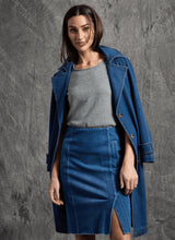 Load image into Gallery viewer, Woman wearing a blue denim trench coat, gray top, and blue skirt against a grey background.