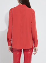 Load image into Gallery viewer, Model wearing a red blouse and red pants against a white background.