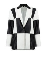 Load image into Gallery viewer, Be bold and unique in this stunning Joseph Ribkoff blazer crafted in soft faux leather and elevated with a striking checker print design. A perfect style to elevate your look, simply pair with a pair of black pants, or skirt and top. Be prepared to receive compliments when you step out in this fabulous blazer. Colors -Black and white. Checker print design. Single button closure. No pockets. No zipper. Not lined.