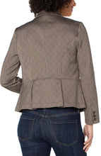 Load image into Gallery viewer, Woman wearing a brown pinstripe blazer over a beige top and blue jeans against a white background.