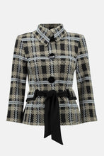 Load image into Gallery viewer, This versatile jacket boasts a funnel collar and a belt-cinch closure to achieve a sharp silhouette. Paired with cropped sleeves and button fastenings, this signature plaid pattern offers an elegant touch. Crafted to last, this timeless design promises a sophisticated look that will remain timeless. Color- Black, white and tan. Black buttons. Cinch belt. Funnel collar. Crop sleeves. Nonfunctional pockets.