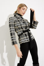 Load image into Gallery viewer, This versatile jacket boasts a funnel collar and a belt-cinch closure to achieve a sharp silhouette. Paired with cropped sleeves and button fastenings, this signature plaid pattern offers an elegant touch. Crafted to last, this timeless design promises a sophisticated look that will remain timeless. Color- Black, white and tan. Black buttons. Cinch belt. Funnel collar. Crop sleeves. Nonfunctional pockets.