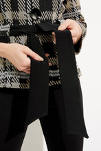 Load image into Gallery viewer, This versatile jacket boasts a funnel collar and a belt-cinch closure to achieve a sharp silhouette. Paired with cropped sleeves and button fastenings, this signature plaid pattern offers an elegant touch. Crafted to last, this timeless design promises a sophisticated look that will remain timeless. Color- Black, white and tan. Black buttons. Cinch belt. Funnel collar. Crop sleeves. Nonfunctional pockets.