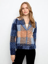Load image into Gallery viewer, A woman modeling a boucle plaid short coat with blue, beige, and orange sections, worn over a white top and black pants against a plain white background.
