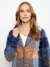 Load image into Gallery viewer, A woman modeling a boucle plaid short coat with blue, beige, and orange sections, worn over a white top against a plain white background.