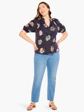 Load image into Gallery viewer, Sometimes it's all in the name! This dramatic combo of dark background and powerful pops of color on this stunning top is an outfit scene stealer, a real conversation piece. It's not just the firework display design though: we love the layered details on the short sleeves, the easy elastic cuffs, the frilled split neck, and the tie front. Dress it up with professional workpants or keep things casual with denim.